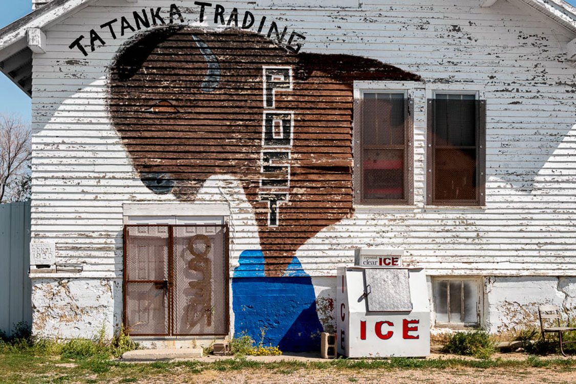 Buffalo painted on wall of wood trading post.